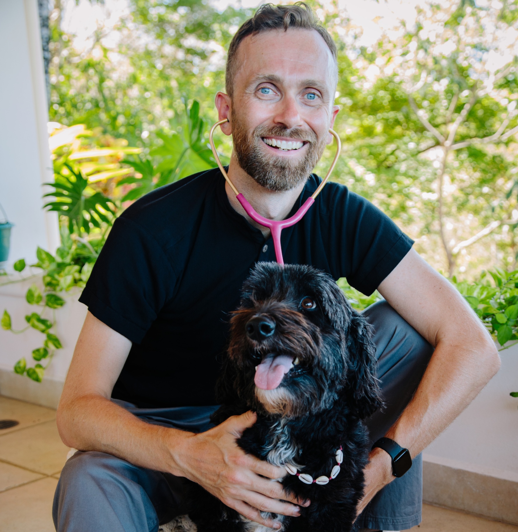 Dr. Justin Shmalberg with a dog